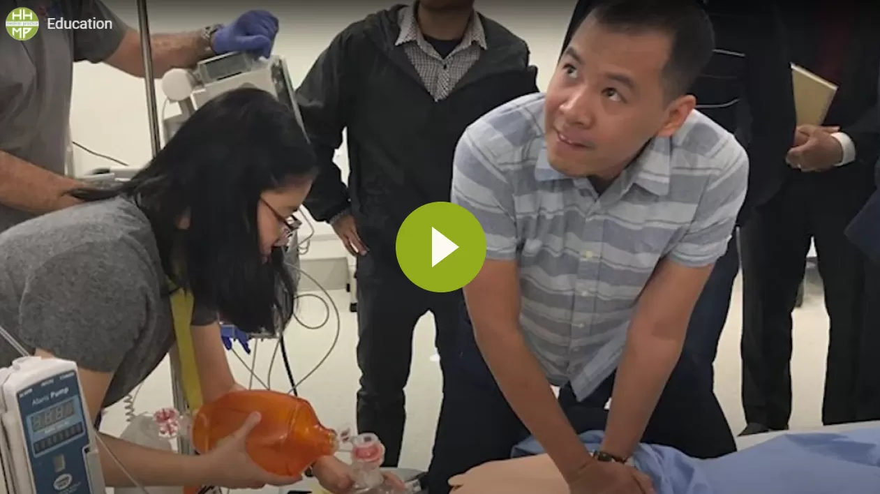 Video thumbnail showing medical trainees practising resuscitation on a manikin