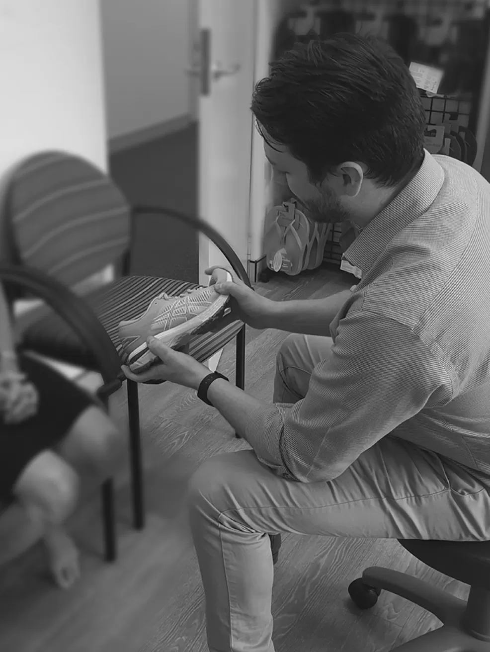 A podiatrist treating a patient's foot in the clinic