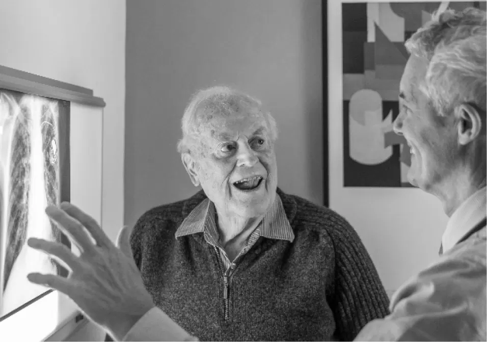A researcher in conversation with an older participant