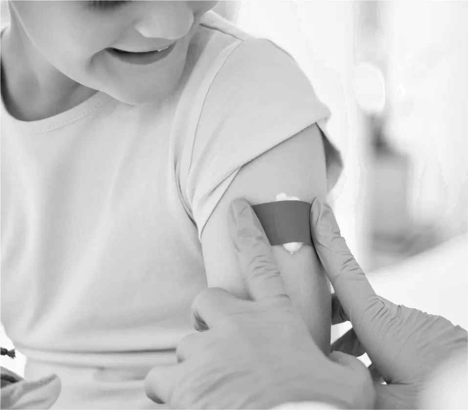 A child receiving a vaccination in the upper arm