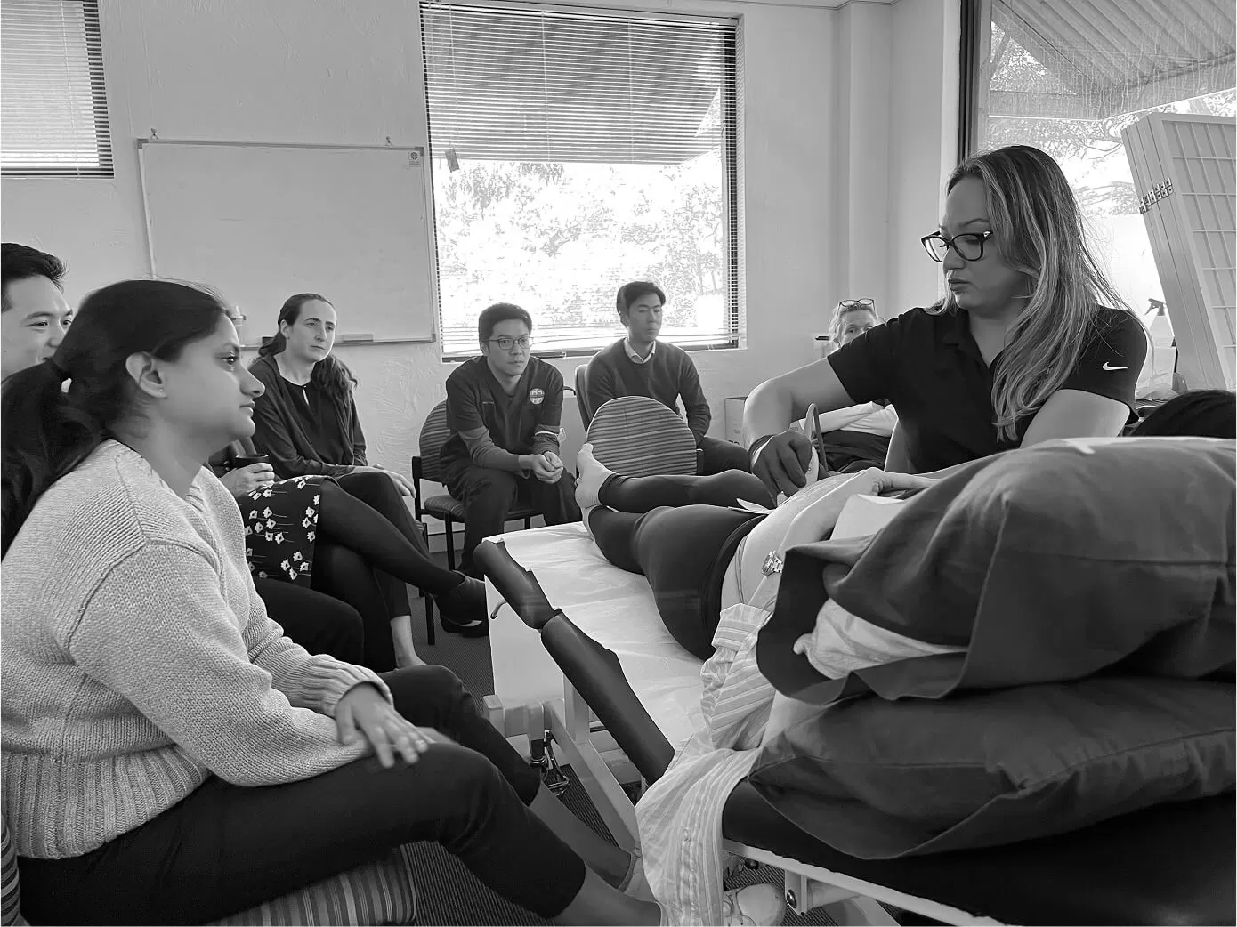 Workshop participants seated for a demonstration in the education room