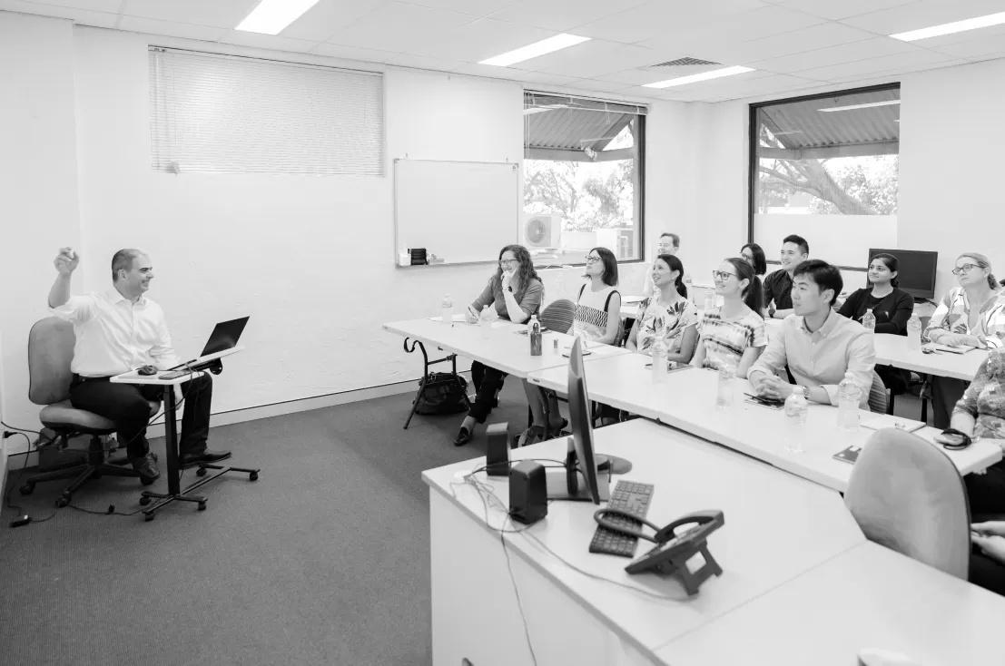 Staff attending a lunchtime education meeting in the HHMP education room