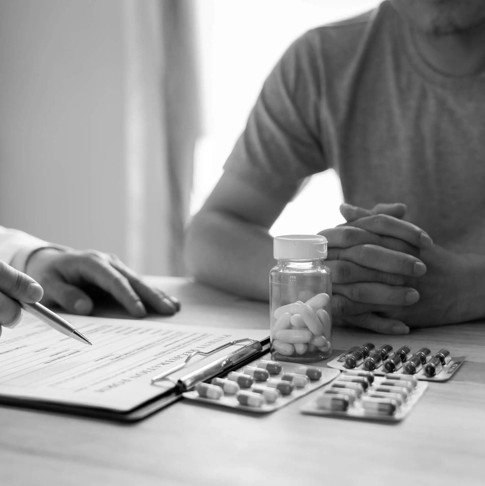 people discuss medication on the table | HHMP medical practice