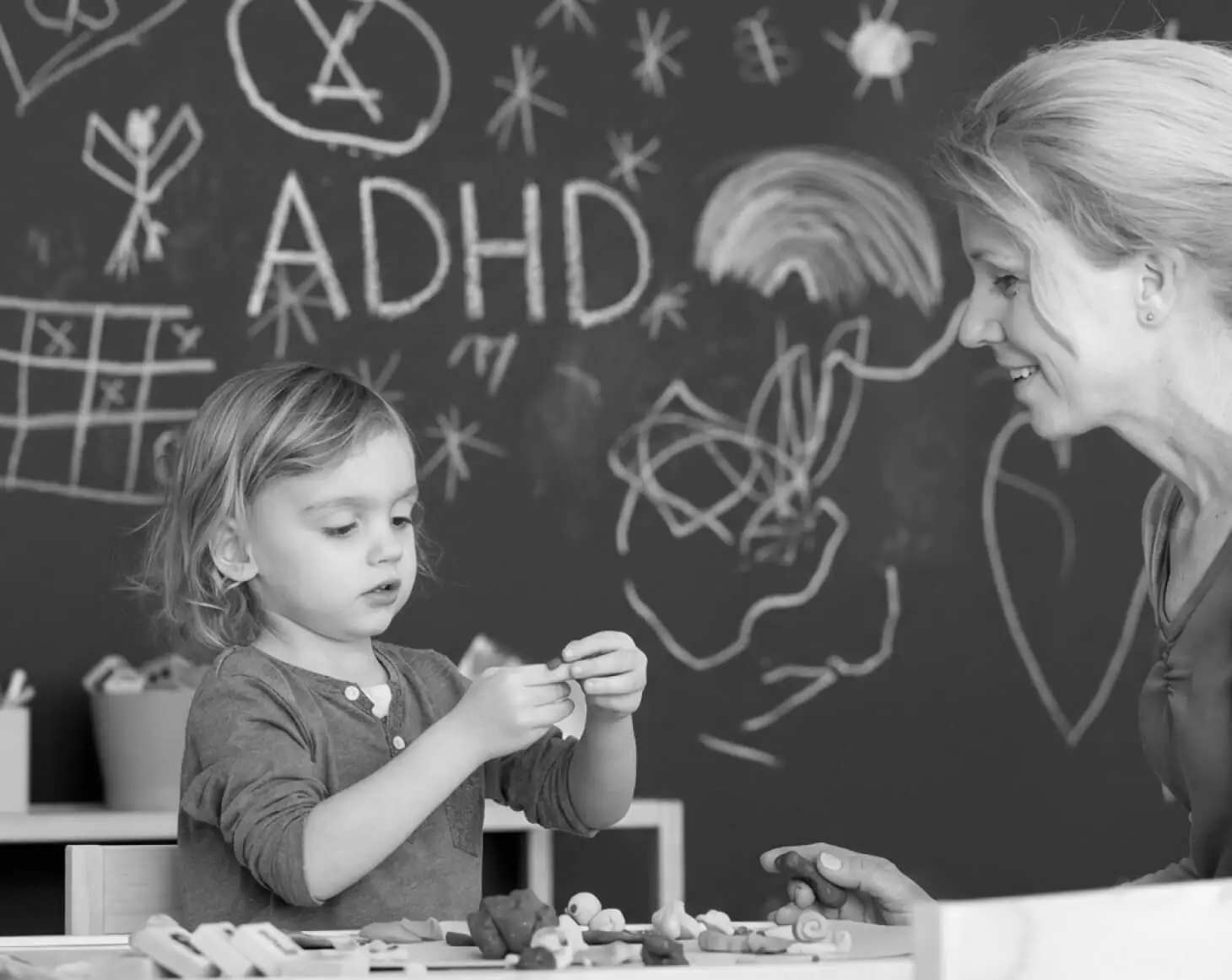 woman talks to child playing | HHMP