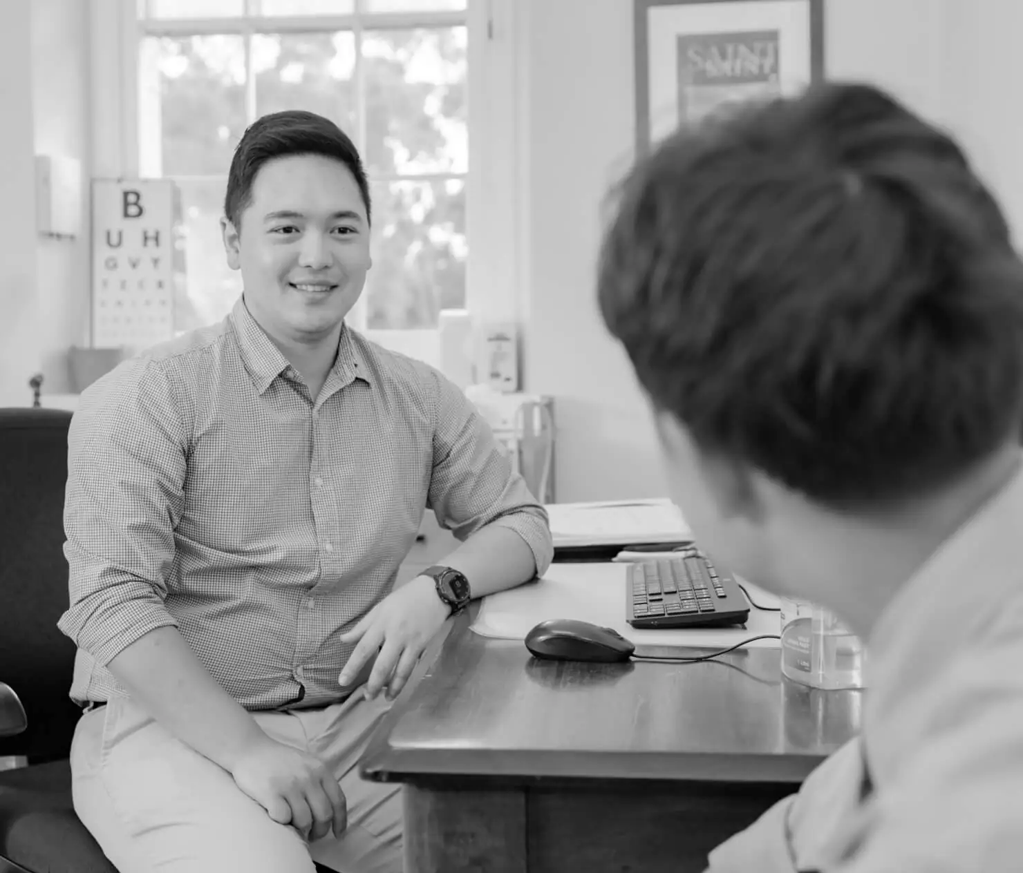 A doctor talking with a patient in a consulting room